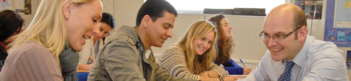 Three students and a teacher on an English course