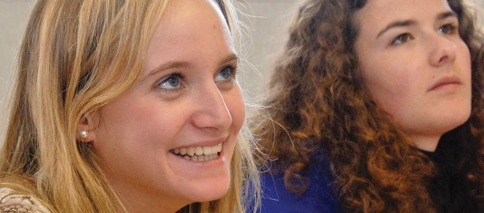 Three students smiling