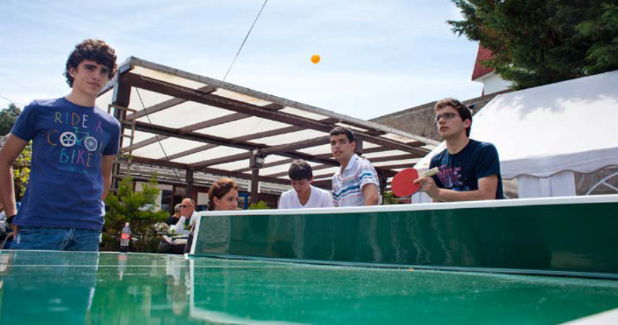 Students playing table tennis