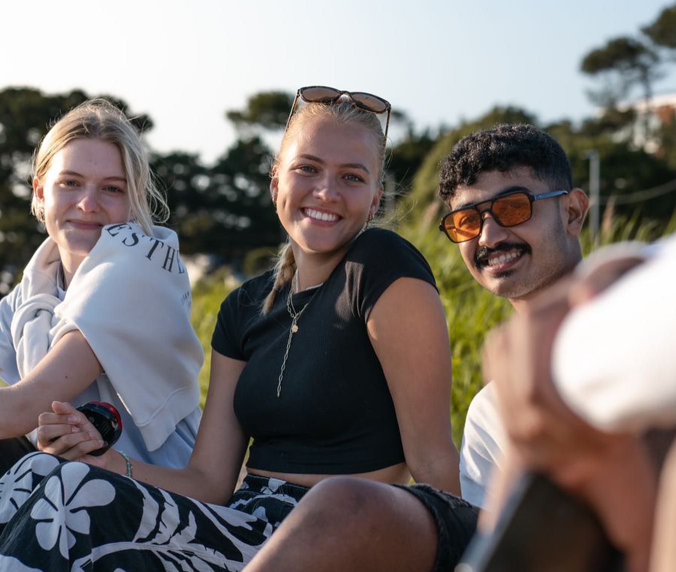 Three students smiling